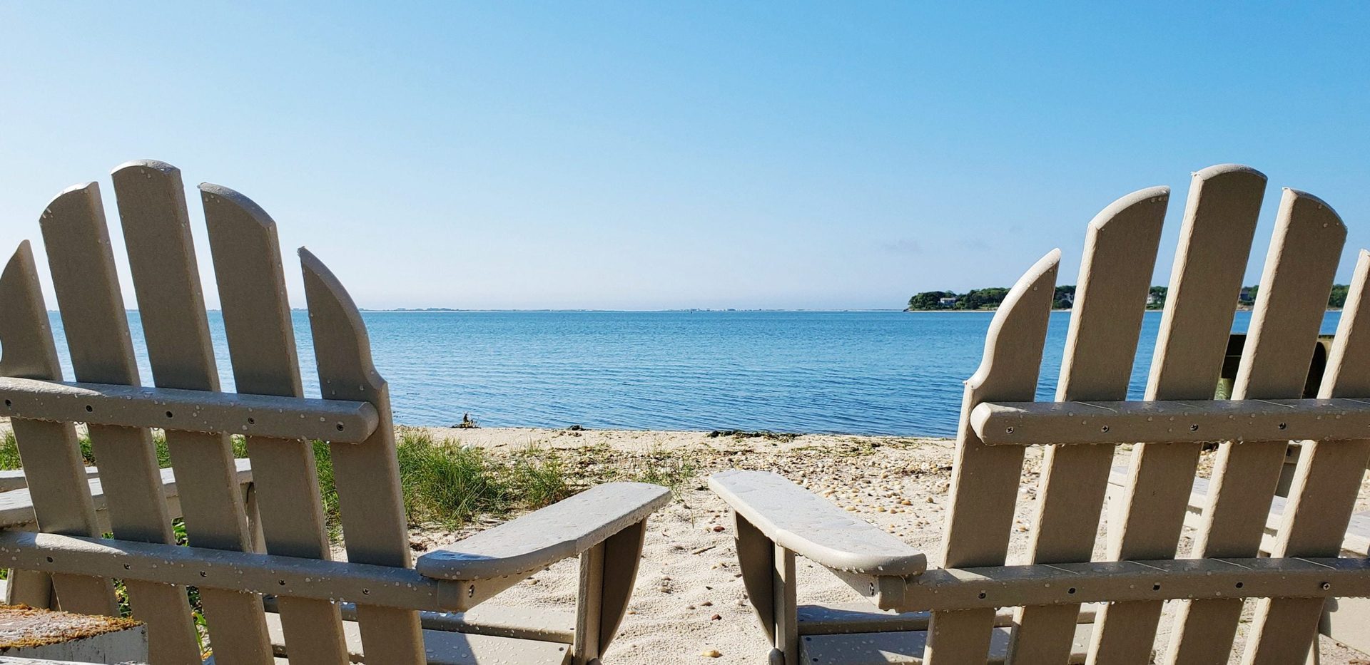 Adirondack chairs facing Shinnecock Bay at Ocean View Terrace Inn, Hampton Bays, NY